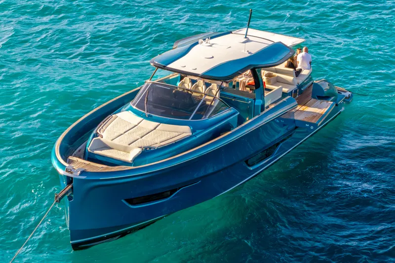 Slide: The Image of 2024 Solaris Power 52 Open yacht on clear blue water, showcasing luxury design. - 5