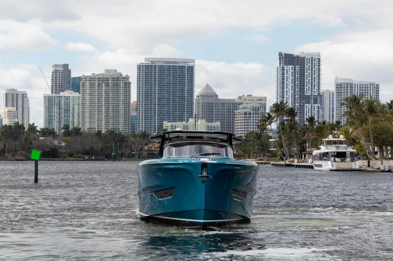 Slide: The Image of 2024 Solaris Power 52 Open yacht cruising in urban waterfront. - 9