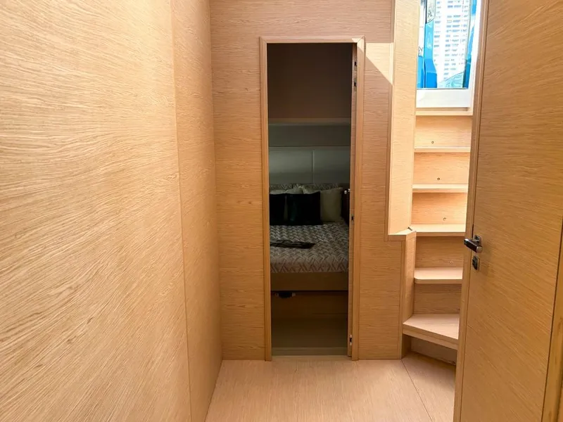 Slide: The Image of Interior cabin of 2024 Solaris Power 52 Open yacht with wooden finish and stairs. - 27