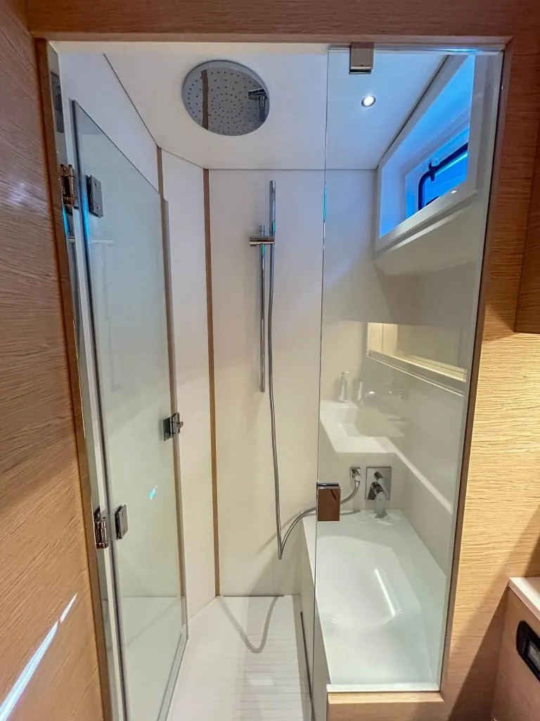 Slide: The Image of Modern bathroom in 2024 Solaris Power 52 Open yacht with glass shower enclosure. - 34