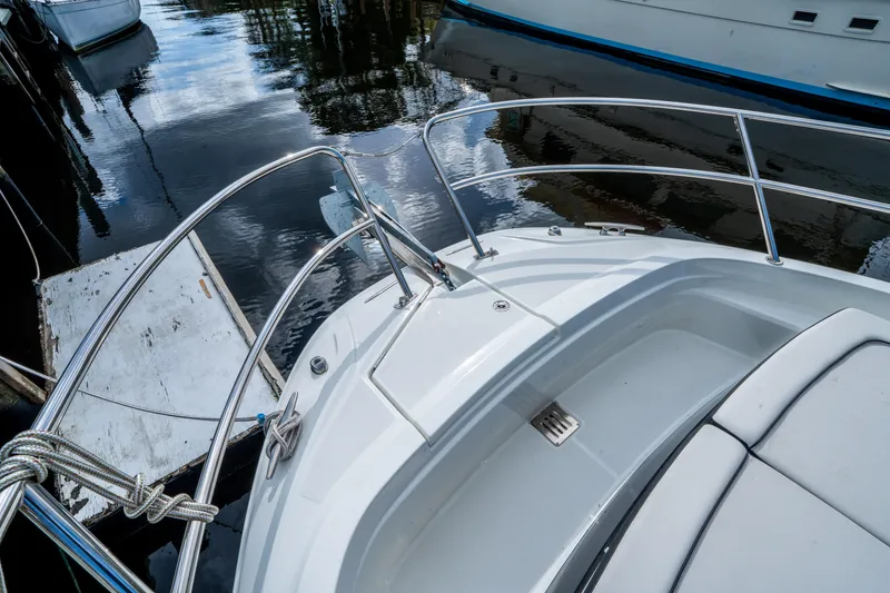 Slide: The Image of 2024 Jeanneau Leader 10.5 WA Series 2 boat docked, showcasing sleek deck design. - 16