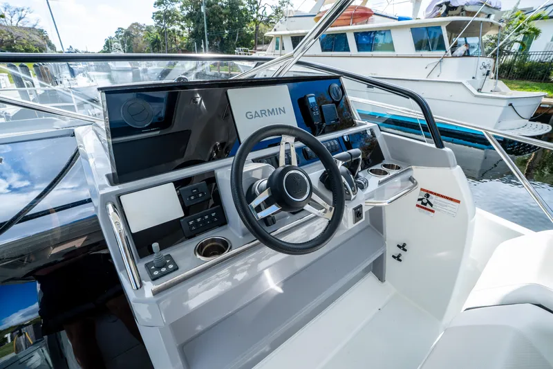 Slide: The Image of 2024 Jeanneau Leader 10.5 WA Series 2 helm with Garmin navigation system. - 26