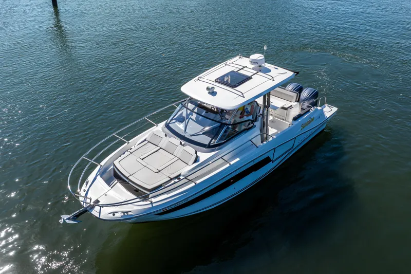 Slide: The Image of 2024 Jeanneau Leader 10.5 WA Series 2 boat cruising on calm water. - 3