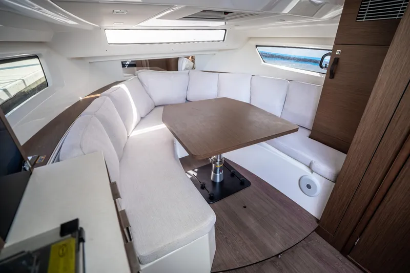 Slide: The Image of Luxurious interior of 2024 Jeanneau Leader 10.5 WA Series 2 with elegant seating and table. - 38