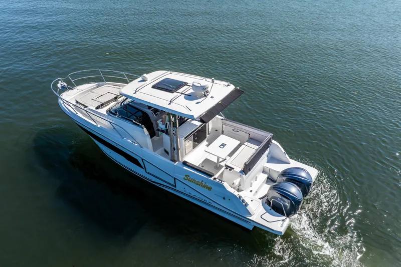 Slide: The Image of 2024 Jeanneau Leader 10.5 WA Series 2 cruising on calm waters, aerial view. - 4