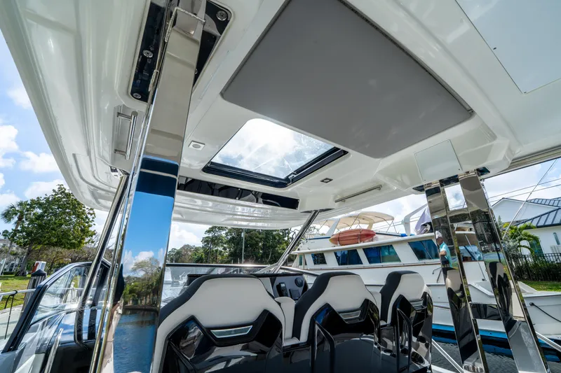 Slide: The Image of 2024 Jeanneau Leader 10.5 WA Series 2 interior with sleek seating and sunroof. - 47