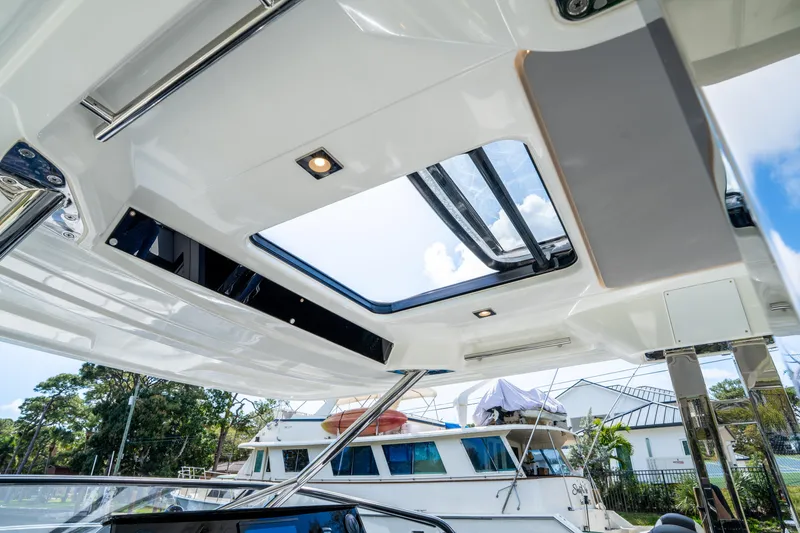 Slide: The Image of 2024 Jeanneau Leader 10.5 WA Series 2 boat interior with sunroof and sleek design. - 48