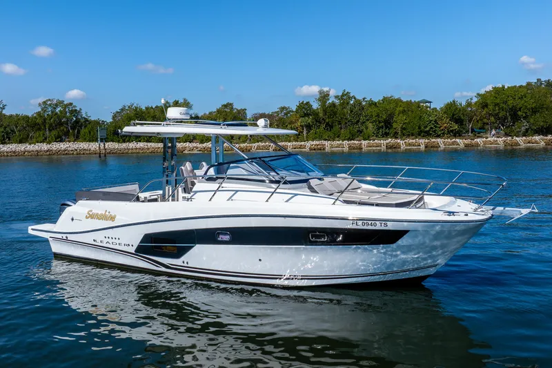 Slide: The Image of 2024 Jeanneau Leader 10.5 WA Series 2 boat on calm water, sunny day. - 5