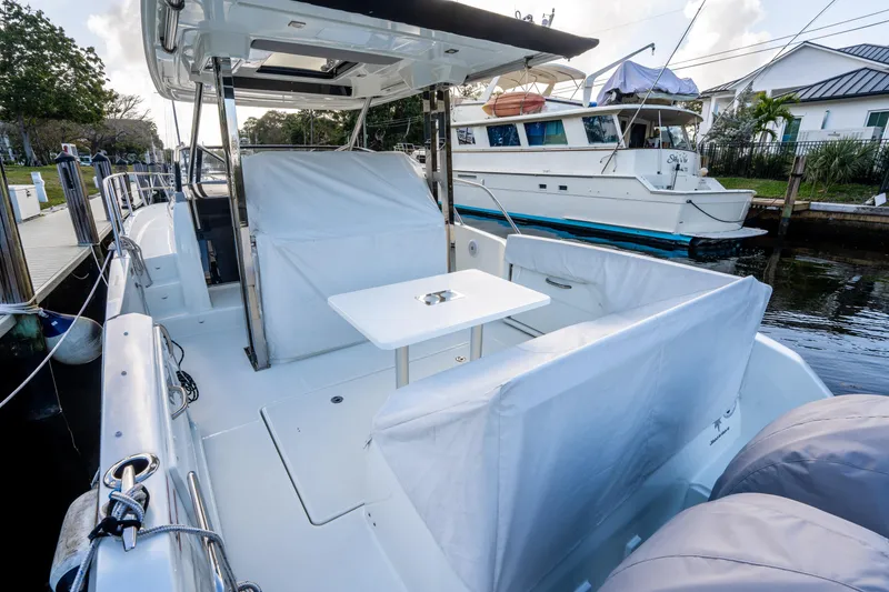 Slide: The Image of 2024 Jeanneau Leader 10.5 WA Series 2 boat interior with seating and table. - 53