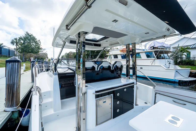 Slide: The Image of 2024 Jeanneau Leader 10.5 WA Series 2 boat docked, showcasing sleek design and modern amenities. - 54