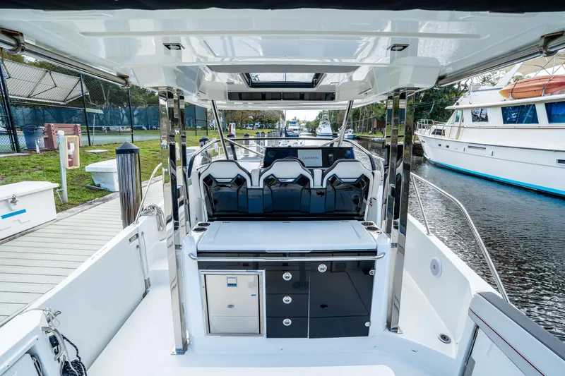 Slide: The Image of 2024 Jeanneau Leader 10.5 WA Series 2 boat interior with sleek seating and modern controls. - 55
