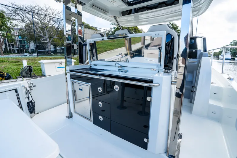 Slide: The Image of 2024 Jeanneau Leader 10.5 WA Series 2 boat interior with sleek kitchen area. - 58