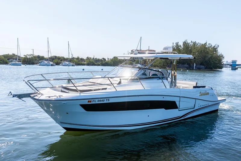 Slide: The Image of 2024 Jeanneau Leader 10.5 WA Series 2 boat cruising on a sunny day. - 6