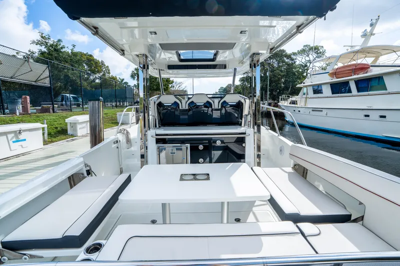 Slide: The Image of 2024 Jeanneau Leader 10.5 WA Series 2 boat interior with seating and table. - 67