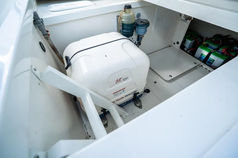 Slide: The Image of 2024 Jeanneau Leader 10.5 WA Series 2 engine compartment with generator and batteries. - 72