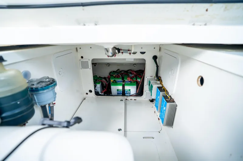 Slide: The Image of 2024 Jeanneau Leader 10.5 WA Series 2 boat battery compartment with wiring and components. - 73