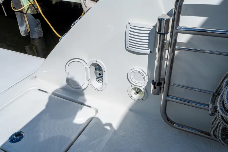 Slide: The Image of 2024 Jeanneau Leader 10.5 WA Series 2 boat deck with access hatches and railing. - 75