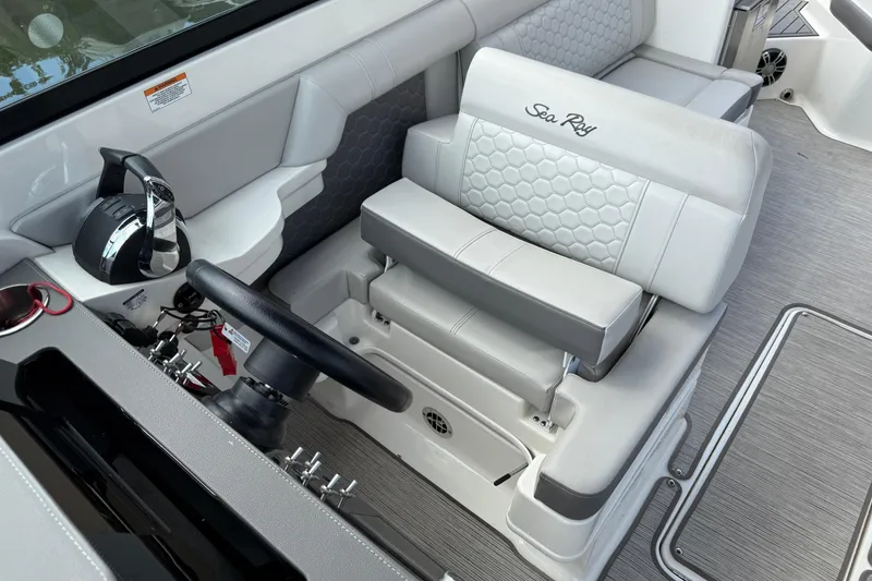 Slide: The Image of 2021 Sea Ray SDX 290 Outboard helm with luxurious seating and modern controls. - 33