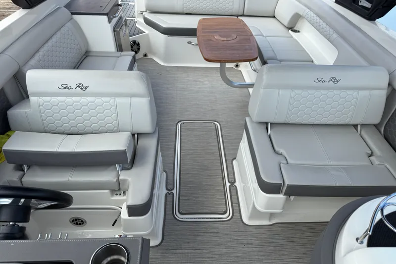 Slide: The Image of Luxurious interior of 2021 Sea Ray SDX 290 Outboard with elegant seating and table. - 34