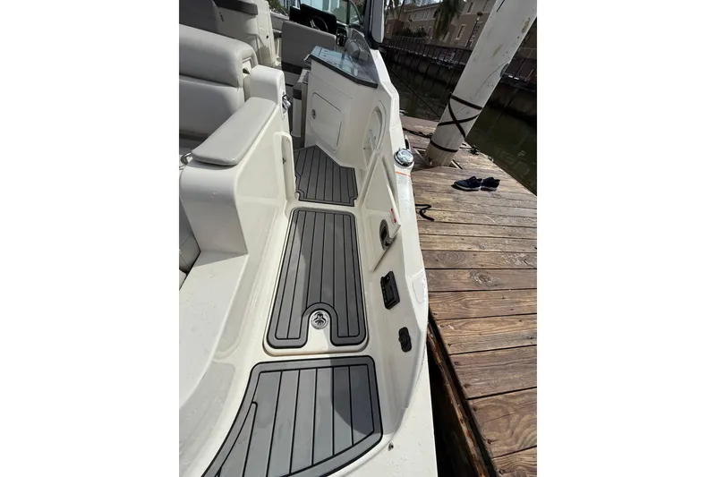 Slide: The Image of 2021 Sea Ray SDX 290 Outboard boat interior with sleek seating and deck design. - 41