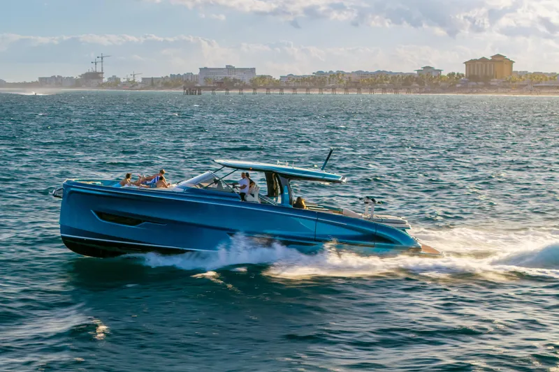 Slide: The Image of 2024 Solaris Power 52 Open yacht cruising on ocean near city skyline. - 44