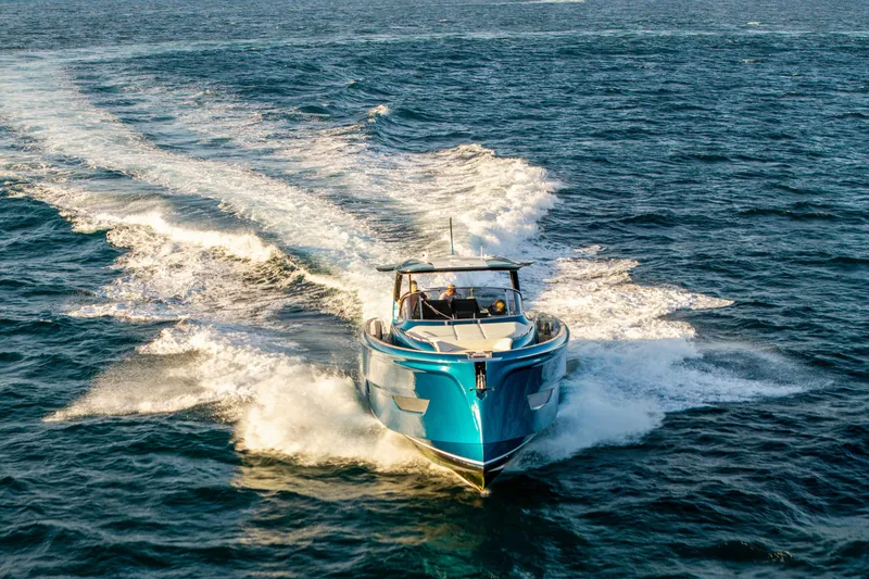 Slide: The Image of 2024 Solaris Power 52 Open yacht cruising on open sea, creating dynamic waves. - 6