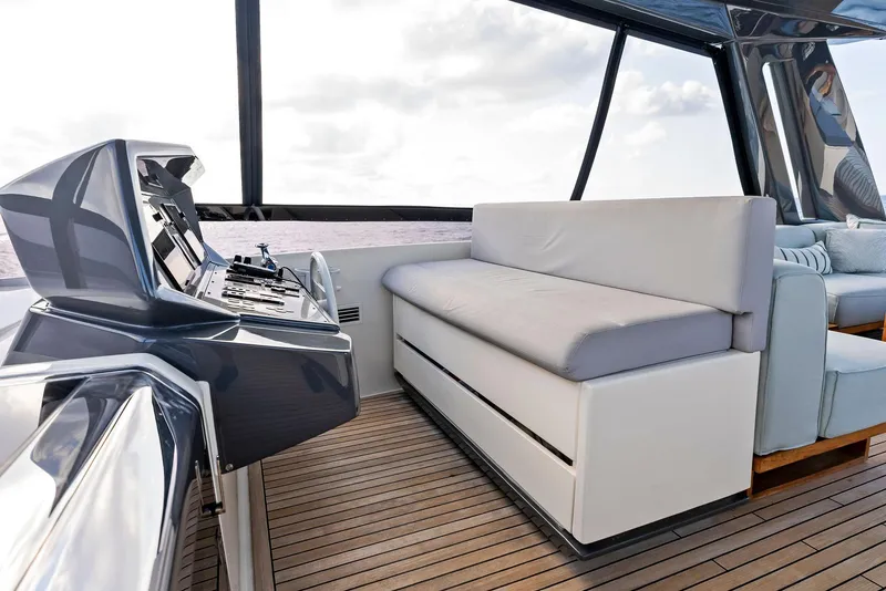 Slide: The Image of Luxurious 2020 Ferretti Yachts 920 interior with sleek helm and comfortable seating. - 19