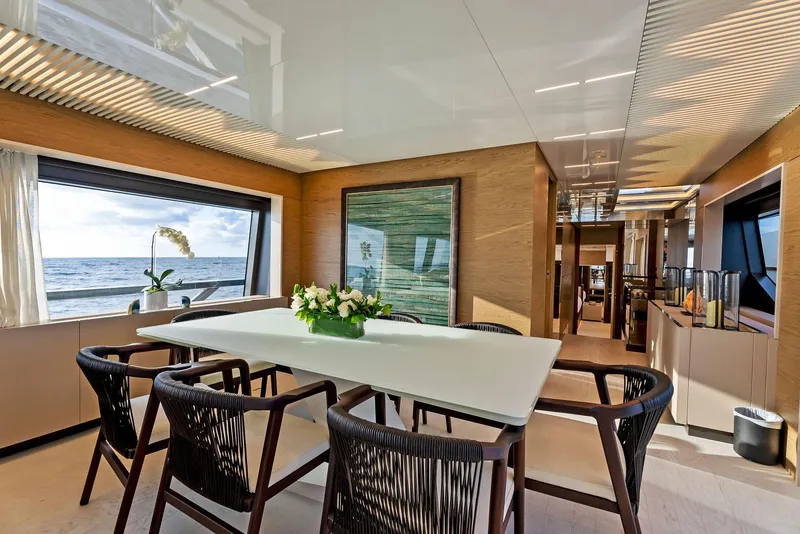 Slide: The Image of Luxurious interior of 2020 Ferretti Yachts 920 with elegant dining area and ocean view. - 26
