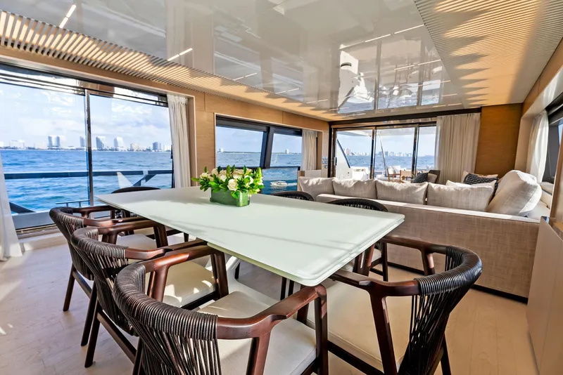 Slide: The Image of Luxurious interior of 2020 Ferretti Yachts 920 with ocean view and elegant dining area. - 28