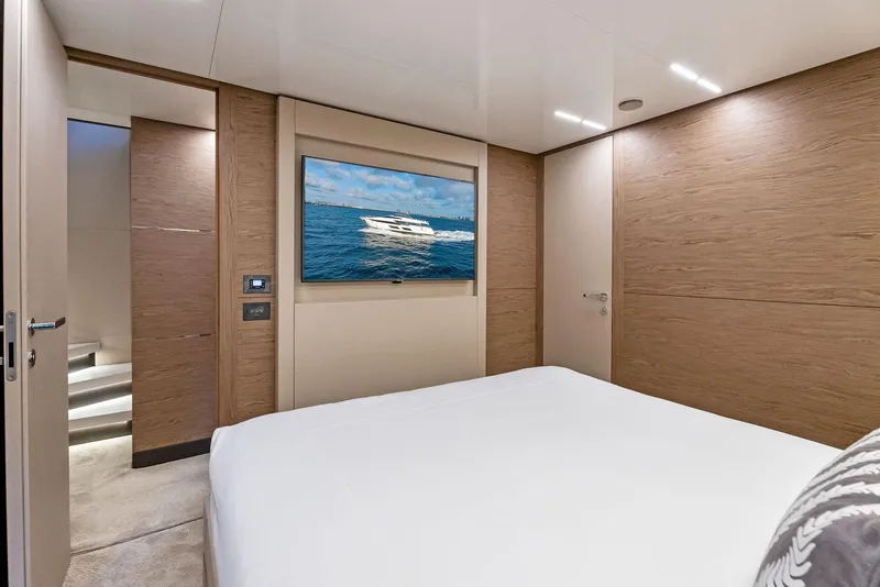 Slide: The Image of Luxurious bedroom interior of 2020 Ferretti Yachts 920 with modern design and wall-mounted TV. - 47