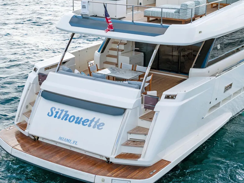Slide: The Image of 2020 Ferretti Yachts 920 on water, rear view, named "Silhouette," docked in Miami, FL. - 7