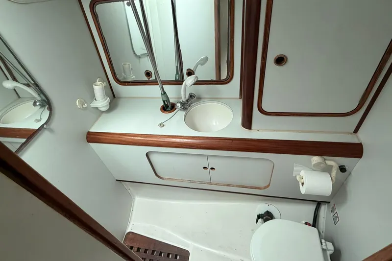 Slide: The Image of Bathroom interior of 1990 Beneteau Oceanis 430 yacht with sink and toilet. - 11