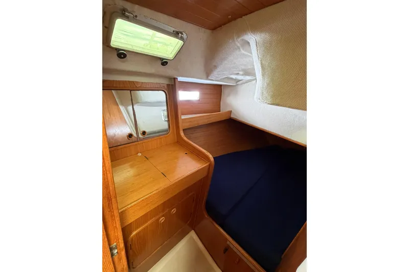 Slide: The Image of Cozy cabin interior of 1990 Beneteau Oceanis 430 sailboat with wooden furnishings. - 5
