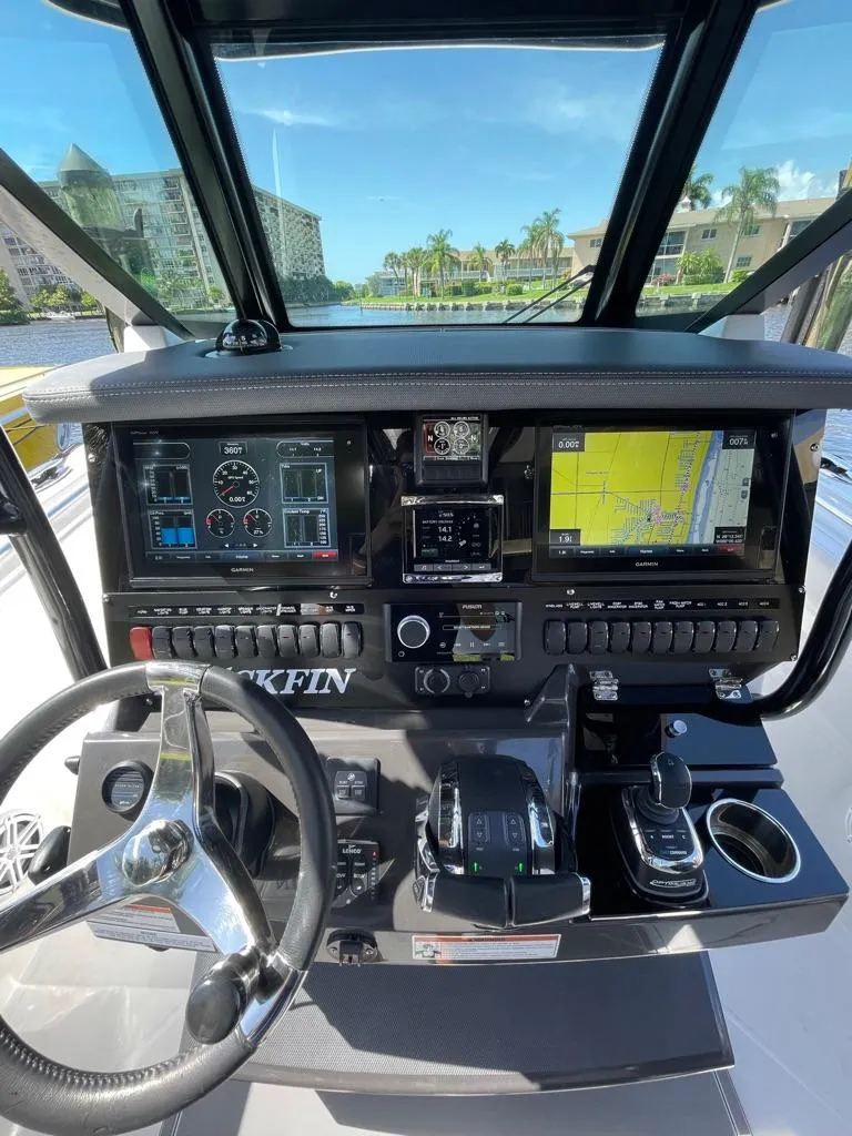 Slide: The Image of 2019 Blackfin 272 CC boat dashboard with navigation screens and controls. - 18