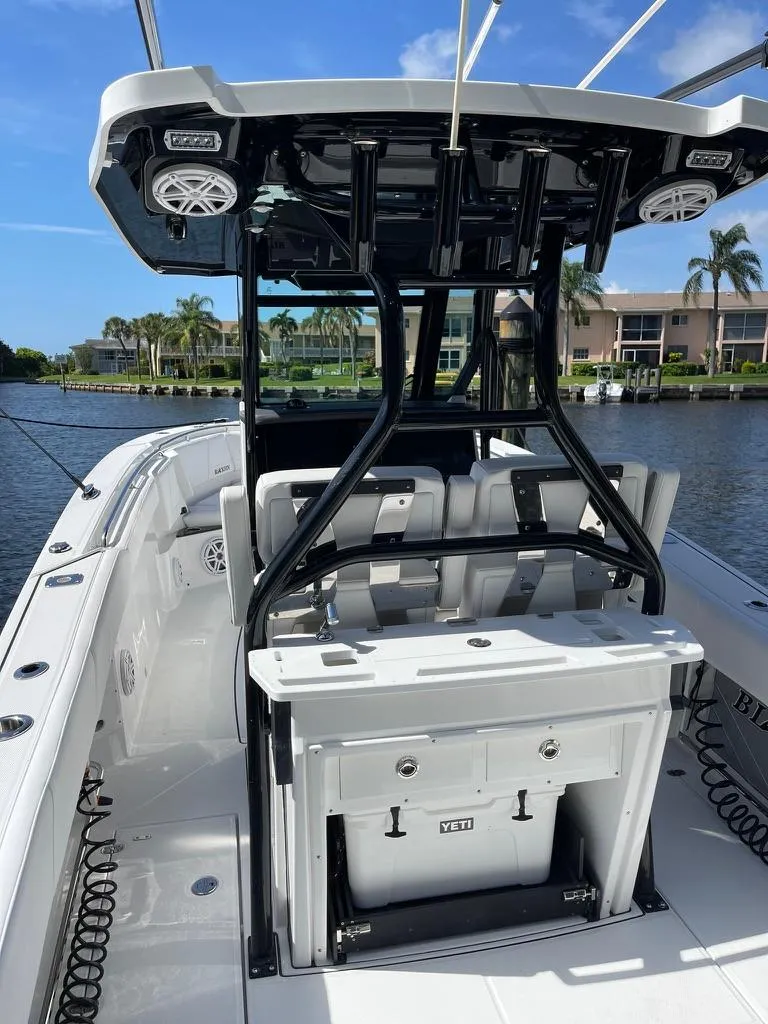 Slide: The Image of 2019 Blackfin 272 CC boat with sleek design, spacious deck, and modern amenities. - 9