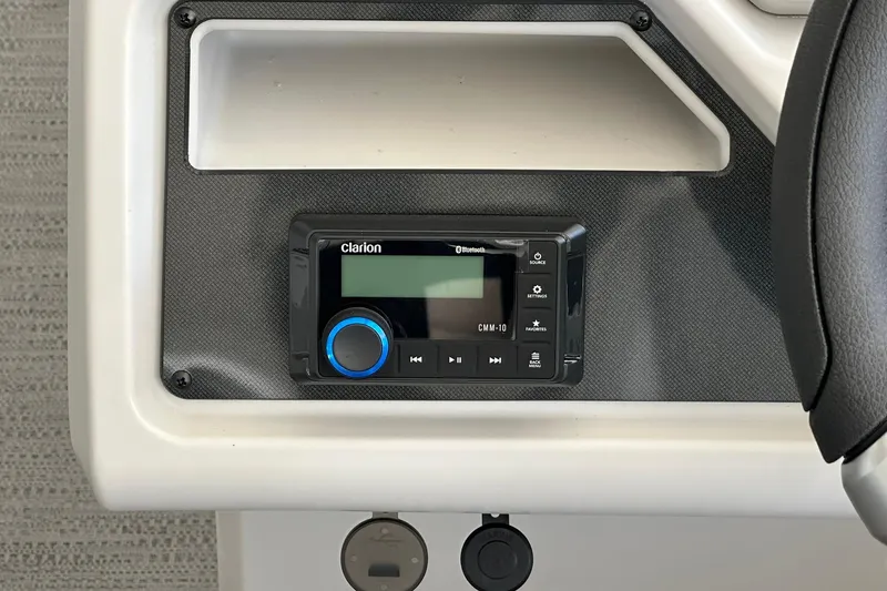 Slide: The Image of Clarion Bluetooth stereo system in 2026 Sweetwater EX2286SBX boat dashboard. - 13