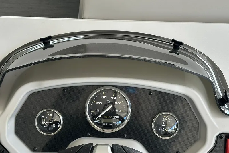 Slide: The Image of Dashboard of 2026 Sweetwater EX2286SBX boat with speedometer and fuel gauge. - 14