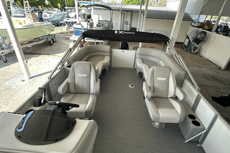 Slide: The Image of 2026 Sweetwater EX2286SBX pontoon boat with spacious seating and modern design. - 19