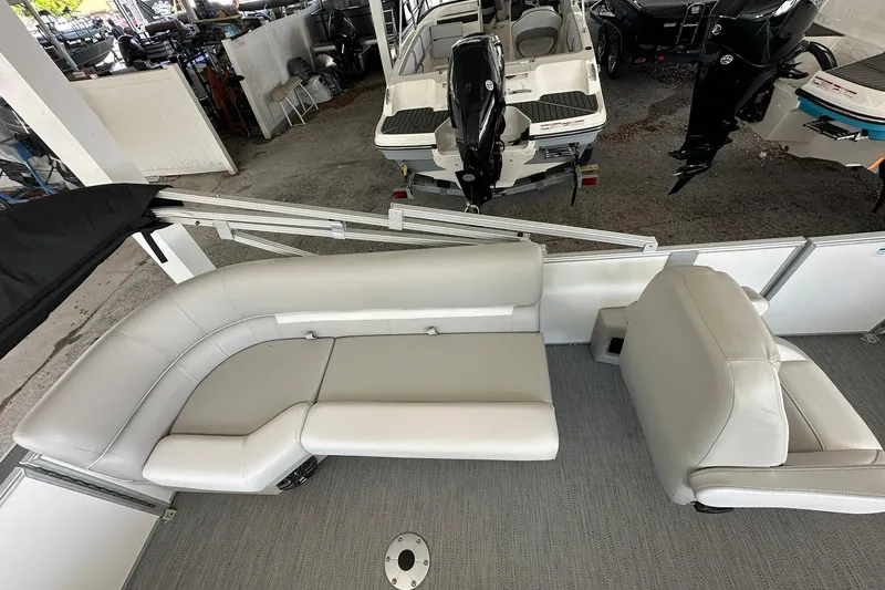 Slide: The Image of 2026 Sweetwater EX2286SBX pontoon boat interior with plush seating and modern design. - 21
