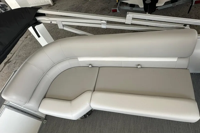 Slide: The Image of 2026 Sweetwater EX2286SBX boat seating, featuring sleek, light gray upholstery and modern design. - 23