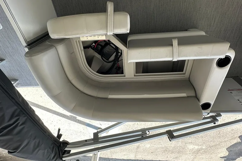 Slide: The Image of Luxurious seating on 2026 Sweetwater EX2286SBX boat, featuring plush cushions and cup holders. - 25