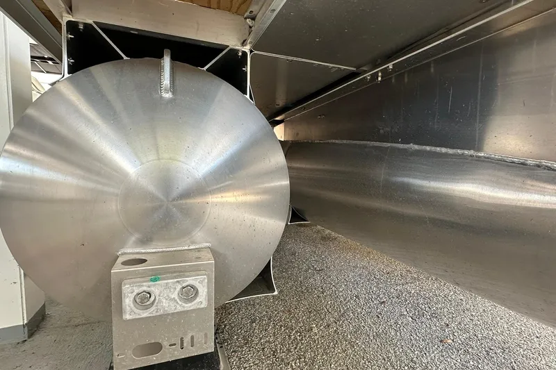 Slide: The Image of Underneath view of a 2026 Sweetwater EX2286SBX pontoon boat, showcasing metal pontoons. - 28