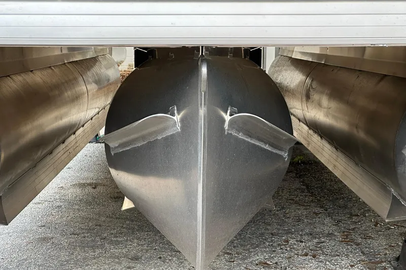 Slide: The Image of 2026 Sweetwater EX2286SBX pontoon boat under storage, showcasing aluminum pontoons. - 3