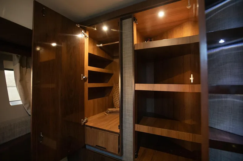 Slide: The Image of Luxurious wooden cabinetry inside 2018 Sea Ray Sundancer 400 yacht, featuring ample storage space. - 15