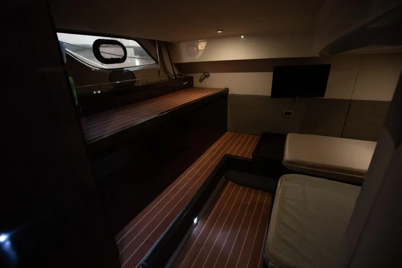 Slide: The Image of Interior of 2018 Sea Ray Sundancer 400 yacht with wooden flooring and cozy seating. - 16