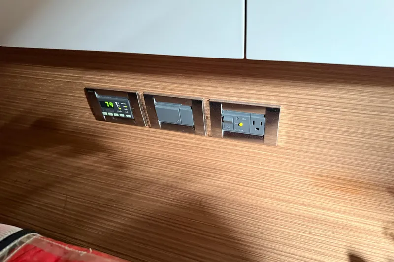 Slide: The Image of Control panel and outlets on 2014 Azimut Atlantis 34 yacht interior. - 12