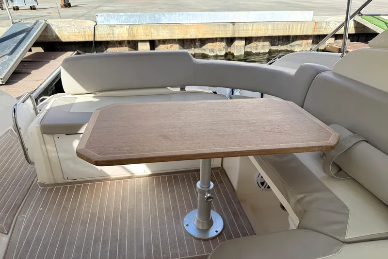Slide: The Image of Luxurious seating area on a 2014 Azimut Atlantis 34 yacht with wooden table. - 6