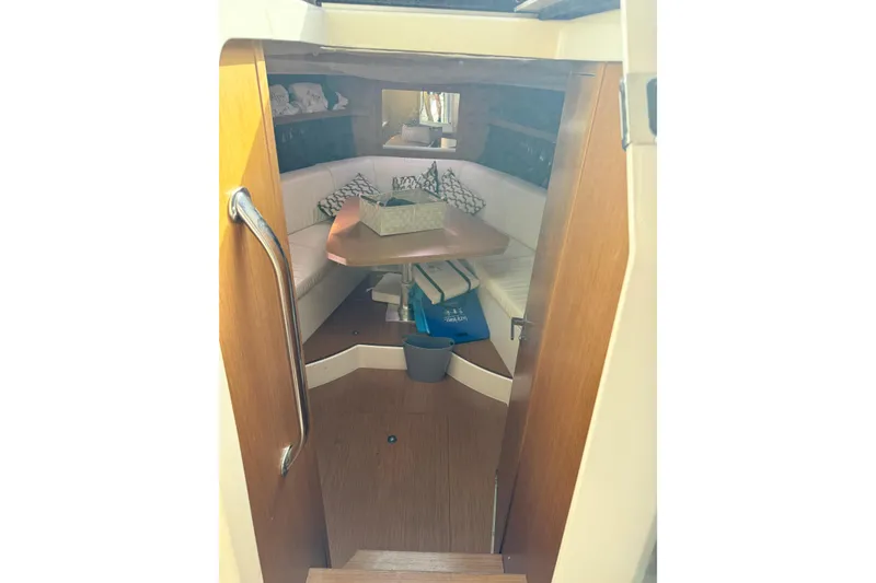 Slide: The Image of Interior of 2014 Azimut Atlantis 34 yacht with cozy seating and wooden accents. - 8