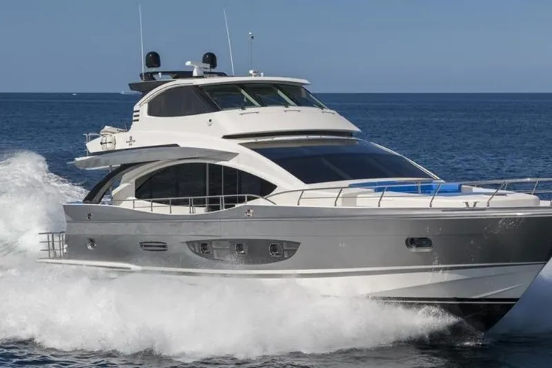 The Image of Luxurious 2014 Hampton Fly yacht cruising on open sea, showcasing sleek design and elegance. - 0