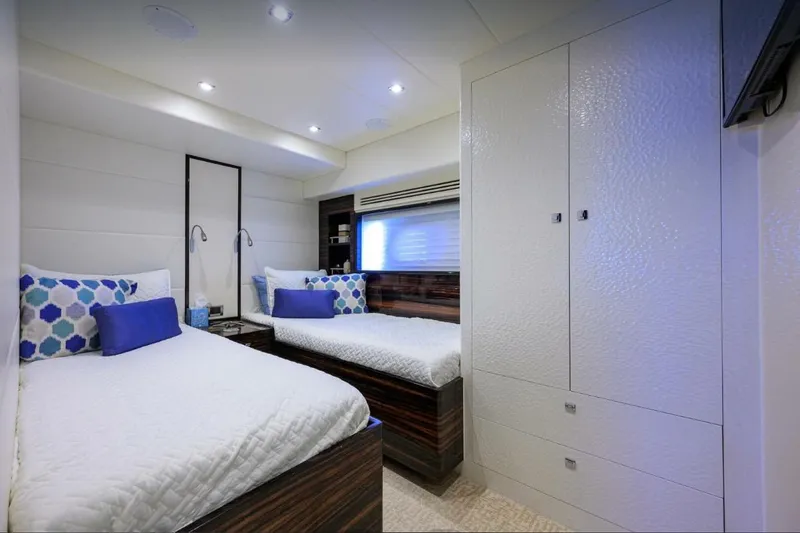 Slide: The Image of Luxurious 2014 Hampton Fly yacht cabin with twin beds and modern decor. - 22